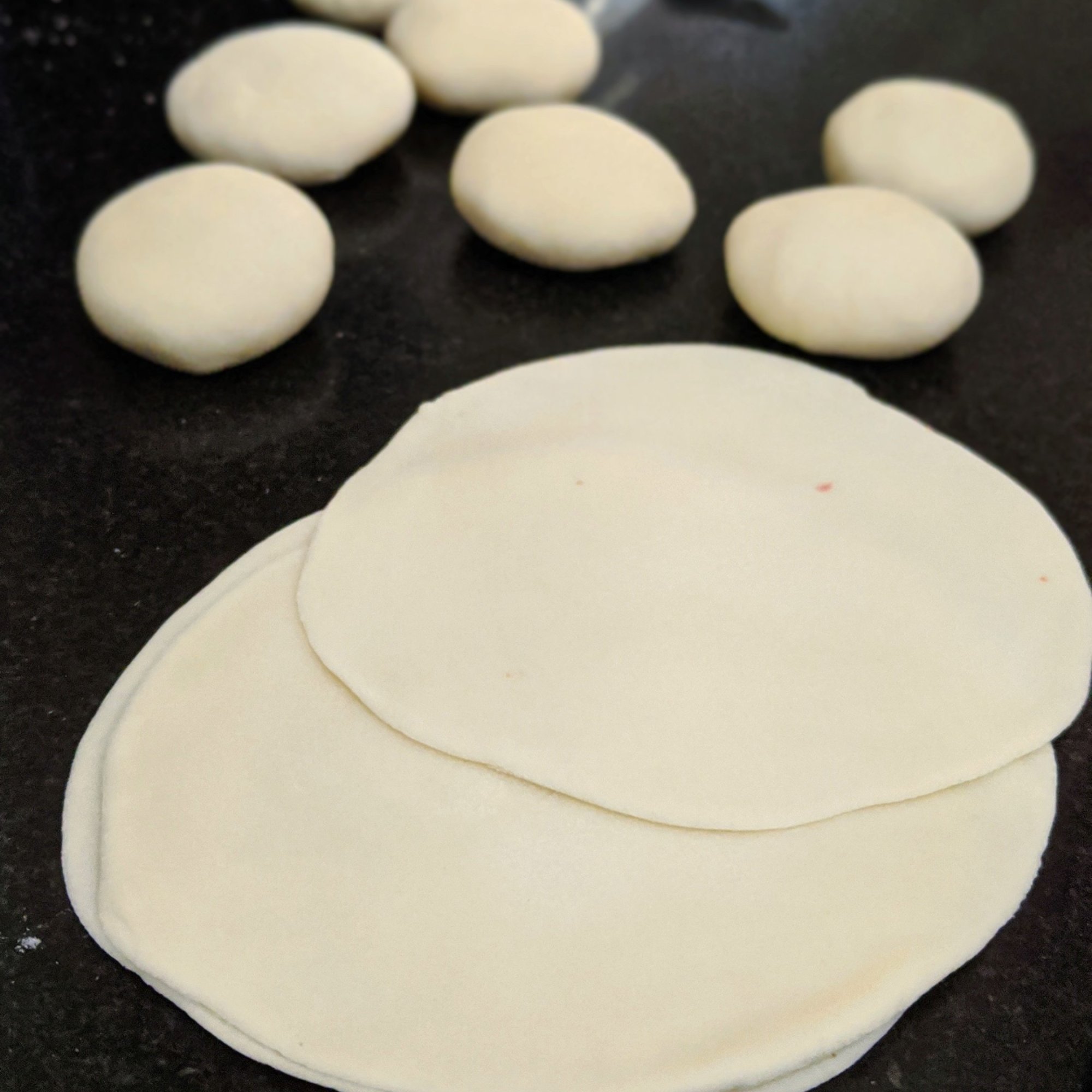 Roll them into 4 inch diameter circle, using a rolling pin.
